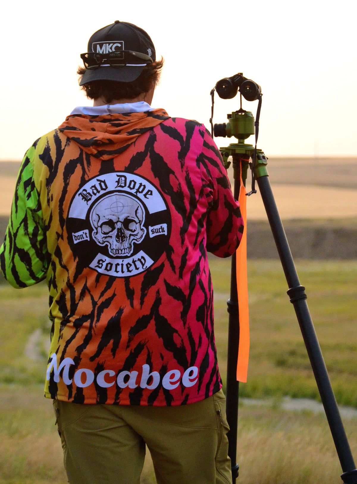 Bad Dope Society custom sun shirt, tiger camo, personalized "Mocabee" print, spotting through a tripod-mounted scope