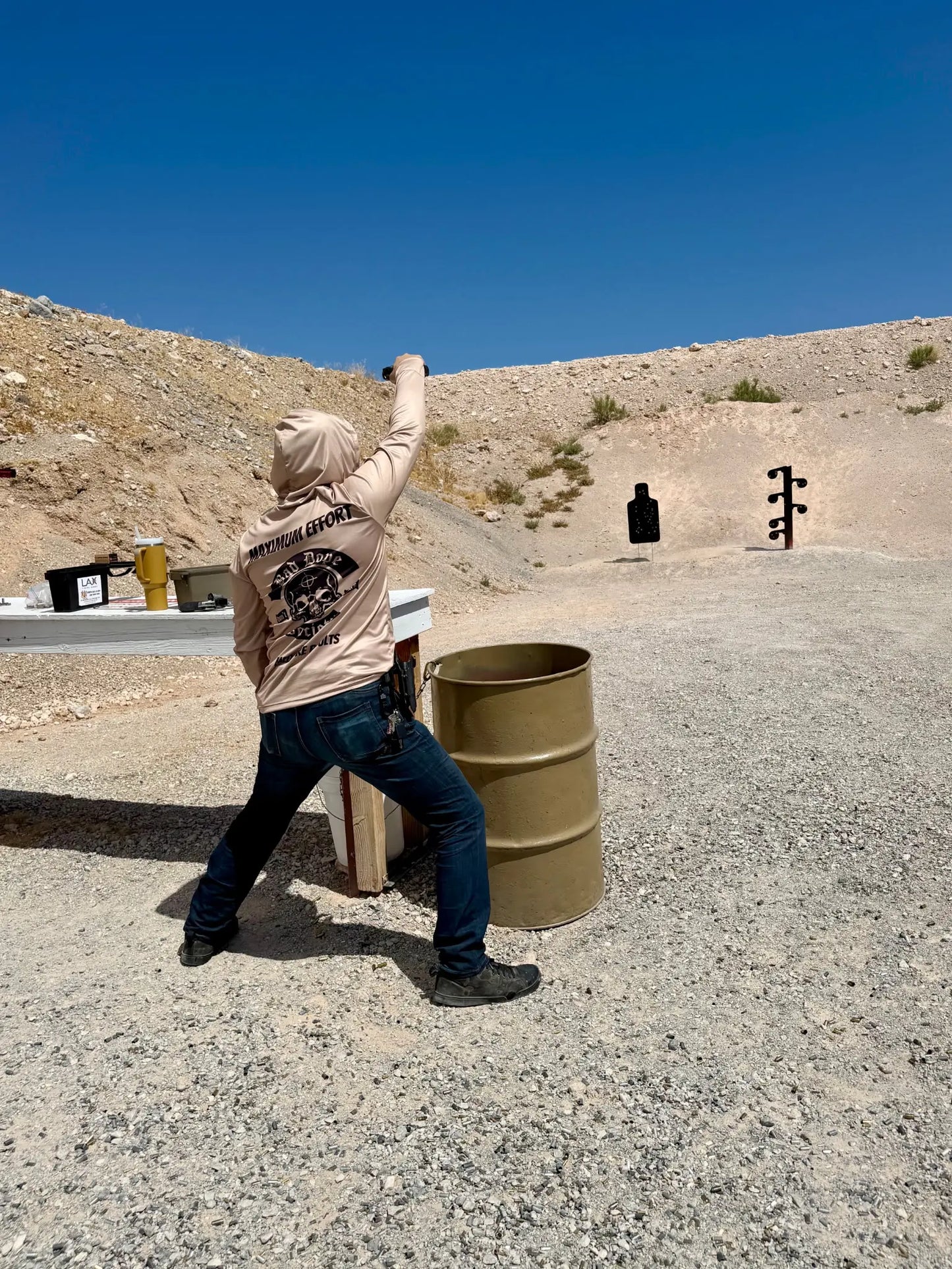 Bad Dope Society Maximum Effort Sun Shirt (Sand), lifestyle, shooting a pistol sideways at the range