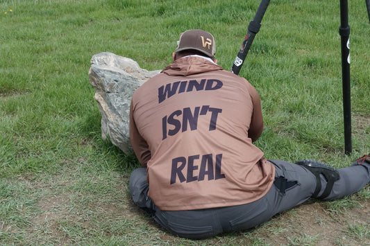 Bad Dope Society Wind Isn't Real Sunshirt (Coyote), lifestyle, sitting behind a rock with a tripod